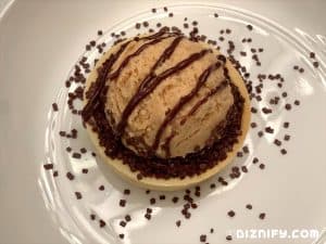 Adding ganache to peanut butter pie