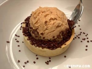 Adding chocolate flakes to peanut butter pie