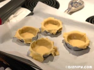 lining tart shells with dough