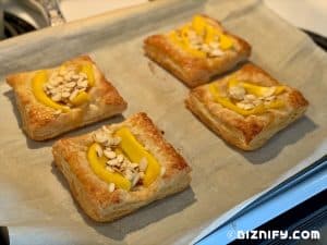 topping mango almond tartlets with almonds