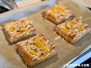 topping mango almond tartlets with icing