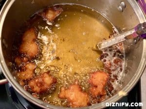 shrimp fritters cooking in oil