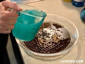 pouring cotton candy lemonade into dish to make ogas obsession copycat