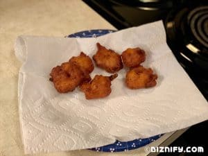 shrimp fritters cooling on a plate