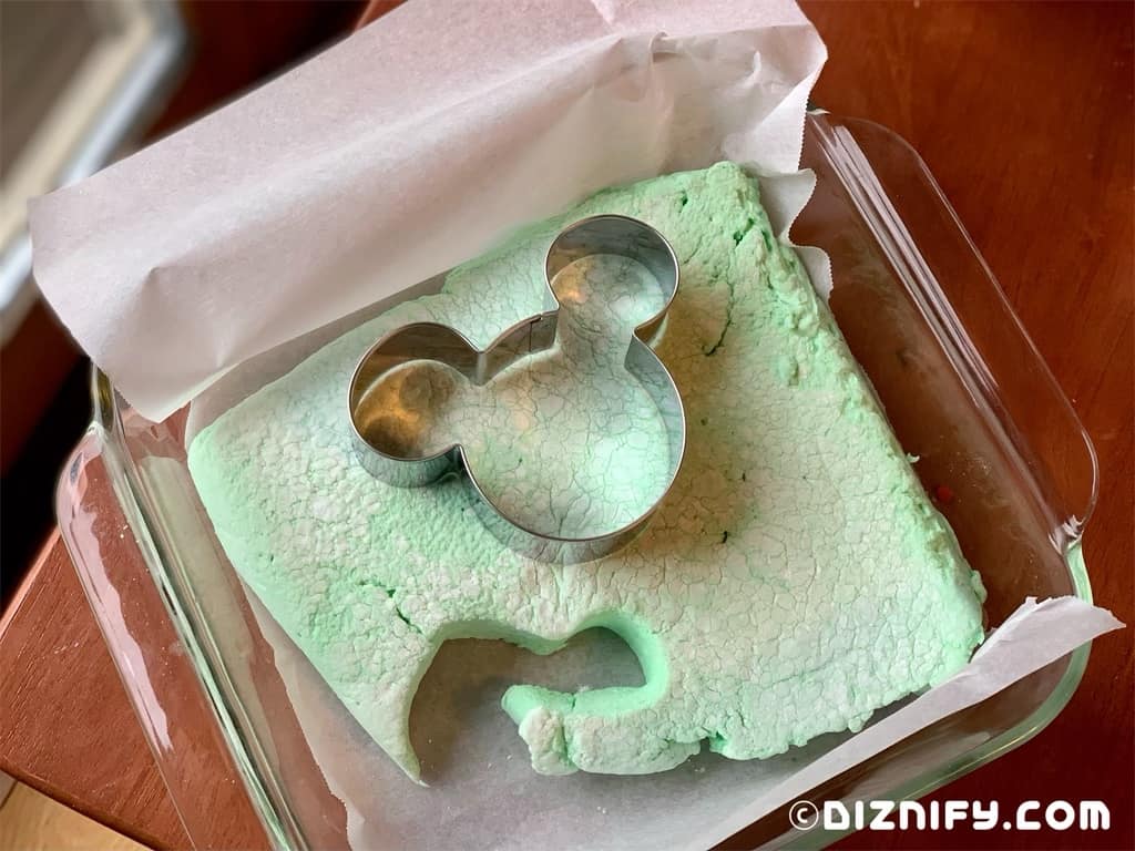 cutting out Mickey shaped marshmallows