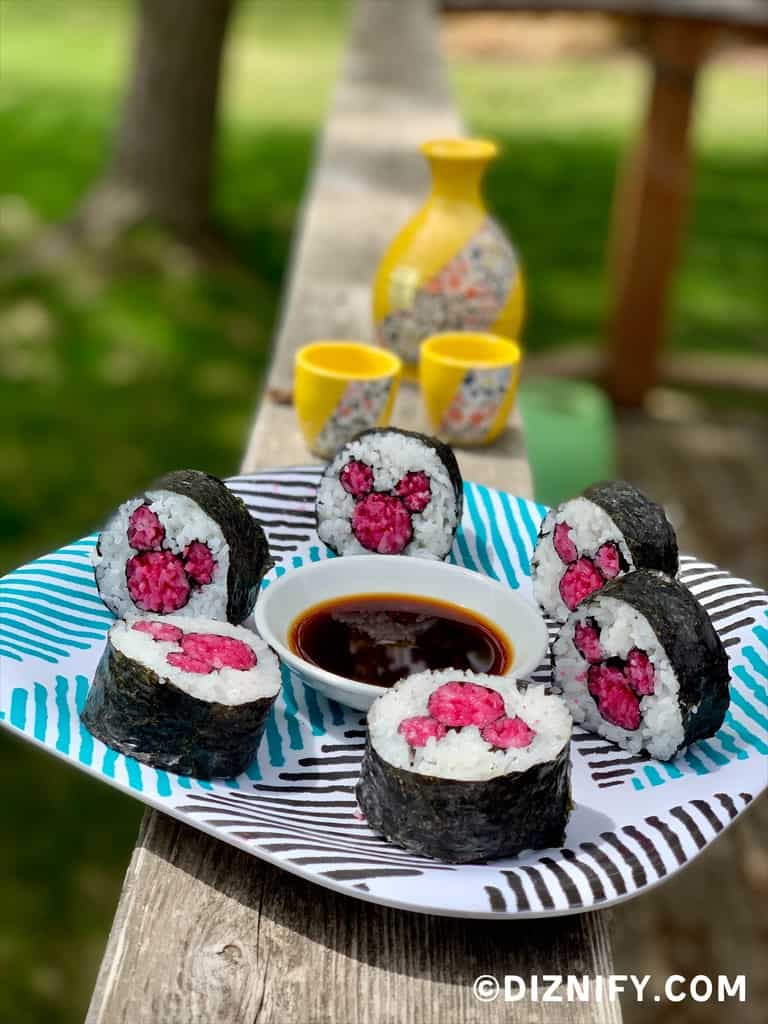 Disney style sushi rolls on a plate outside