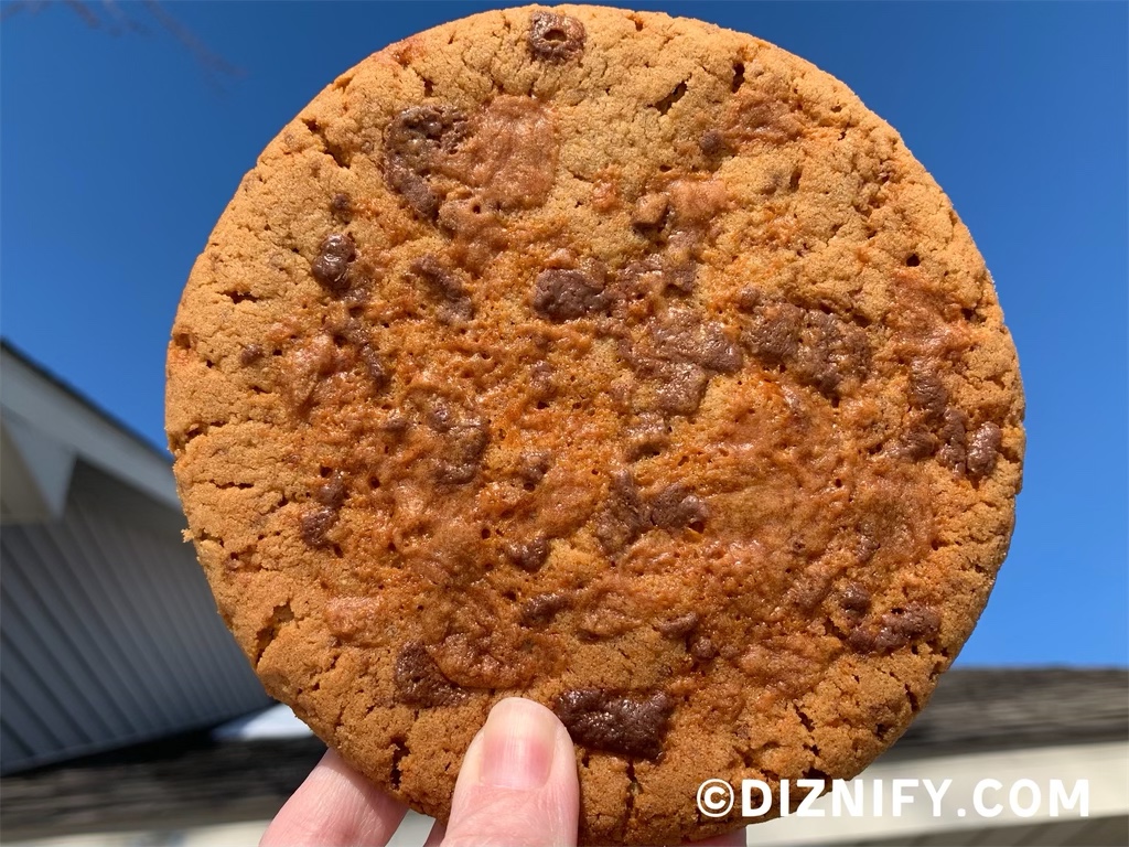 holding one butterfinger peanut butter cookie