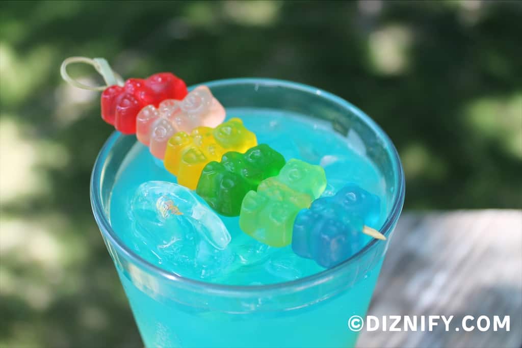 closeup of gummy bears on top of the rainbow drink